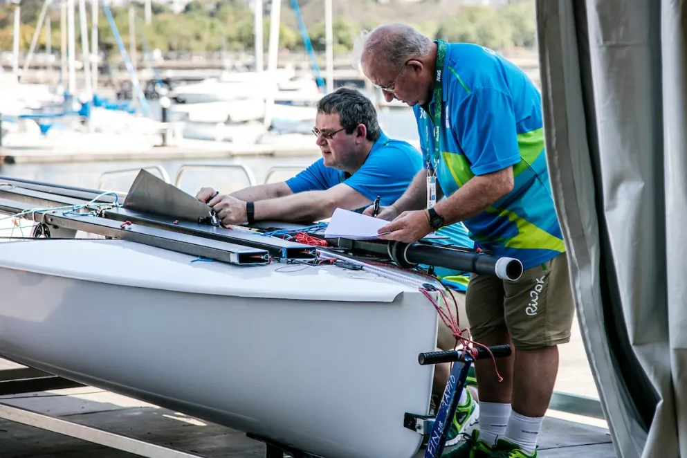 Race officials inspecting boat