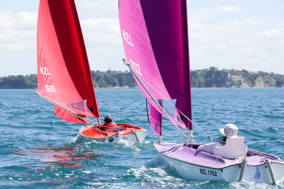 2 people parasailing in sea