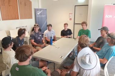 Playing cards is one way sailors have been passing the time while they wait for the breeze to come in.