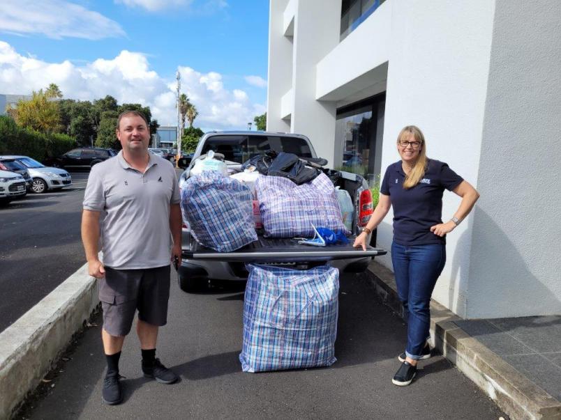 Raynor Haagh, Yachting NZ's National Sport Development Director, and regional development manager Hayden Whitburn with items donated by the organisation. 