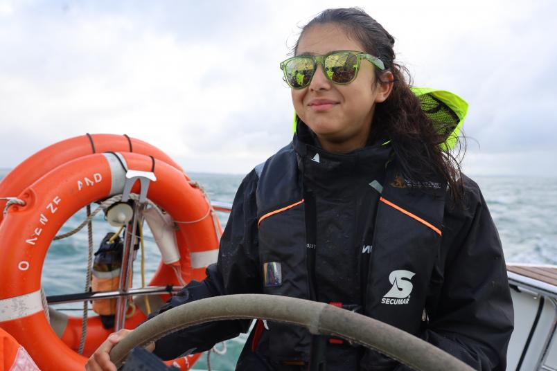 Cambridge Yacht Club's Kheeesa Rahman at the helm on board Lion New Zealand. Photos / Blake NZ